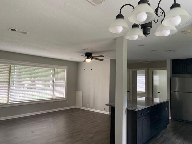 1000 Thomas Avenue Conroe, TX 77301 - Photo 4 of 20 a view of a hallway with a chandelier fan and windows