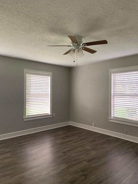1000 Thomas Avenue Conroe, TX 77301 - Photo 7 of 20 a view of an empty room with wooden floor and a window