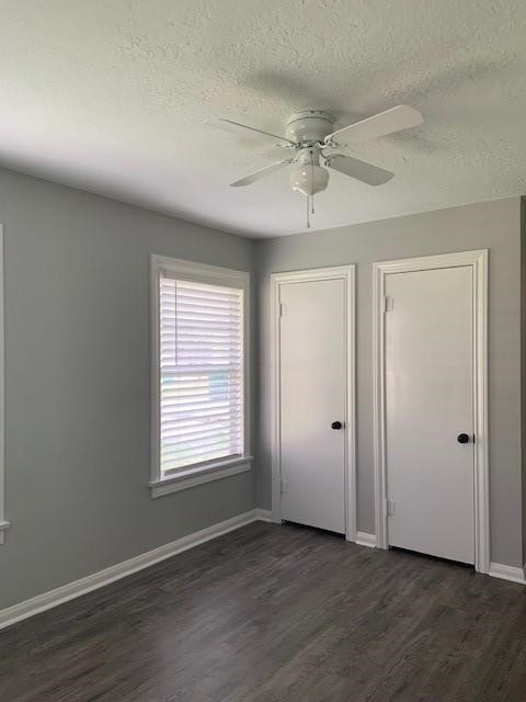 1000 Thomas Avenue Conroe, TX 77301 - Photo 9 of 20 a view of an empty room with wooden floor and a window