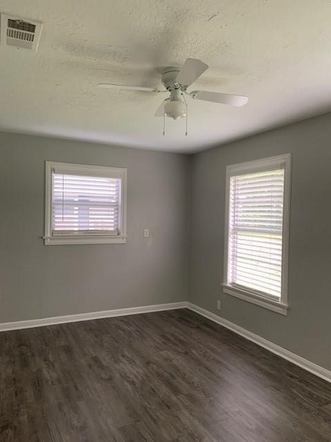 1000 Thomas Avenue Conroe, TX 77301 - Photo 10 of 20 a view of an empty room with wooden floor and a window