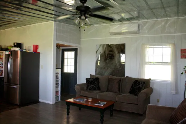 a kitchen with cabinets a sink a window and stainless steel appliances