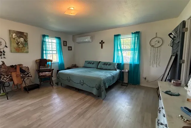 a view of backyard with wooden fence and large trees