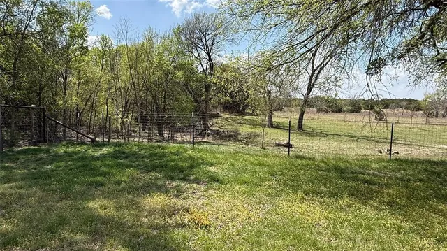 a fire hydrant in the middle of a field