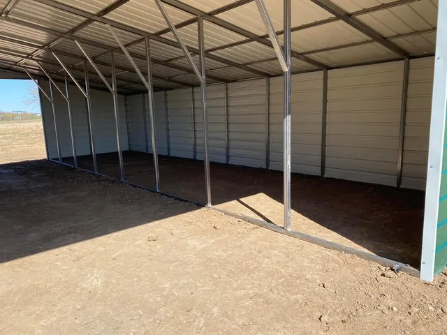 a backyard of a house with a bench and wooden floor