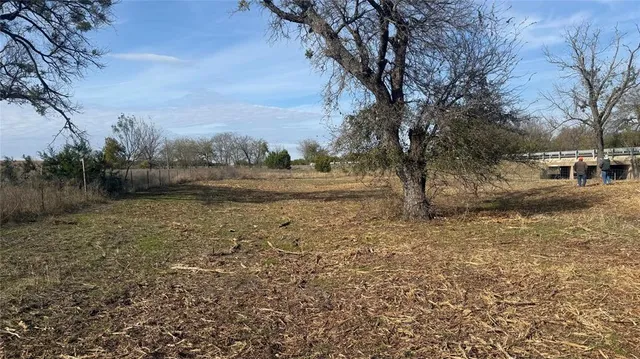 a black and white house with a yard