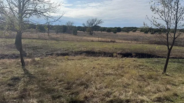 a view of a lake with houses in the back