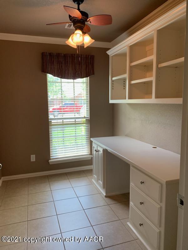 5803 South Rusk Street Amarillo, TX 79118 - Photo 5 of 23 a room with window and chandelier