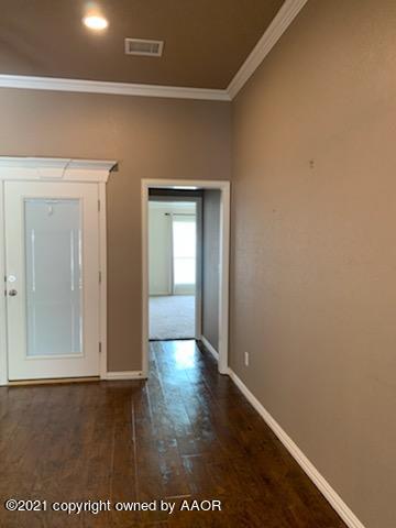 5803 South Rusk Street Amarillo, TX 79118 - Photo 9 of 23 a view of an empty room and closet area