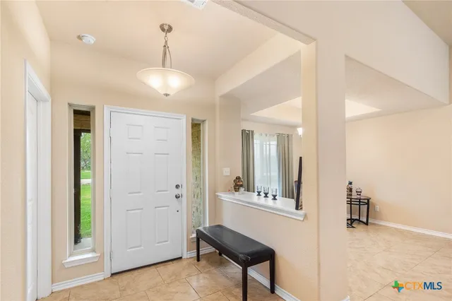 a view of a room with cabinet and mirror