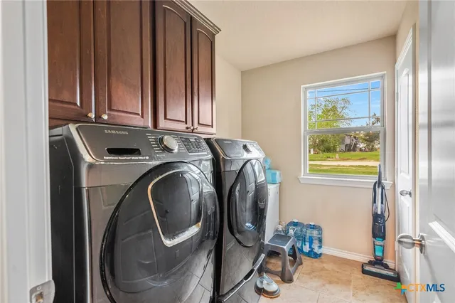 a utility room with dryer and washer