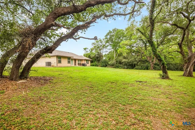 a house view with swimming pool