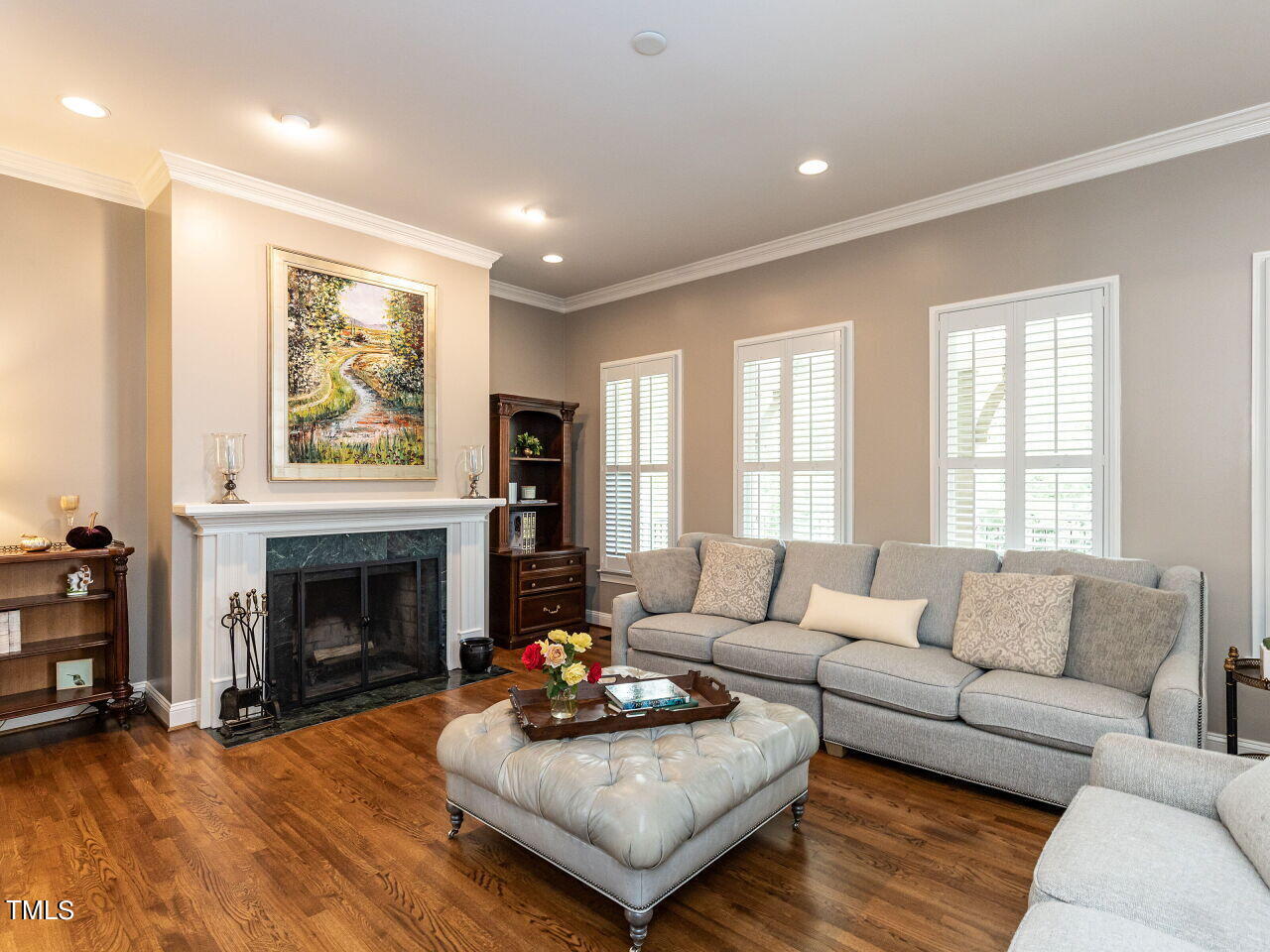 3108 Agecroft Road Raleigh, NC 27608 - Photo 12 of 42 a living room with furniture and a fireplace