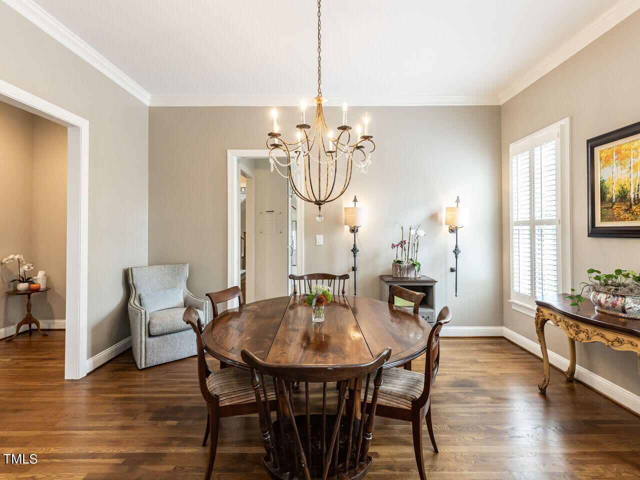 3108 Agecroft Road Raleigh, NC 27608 - Photo 15 of 42 a dining room with chandelier and wooden floor