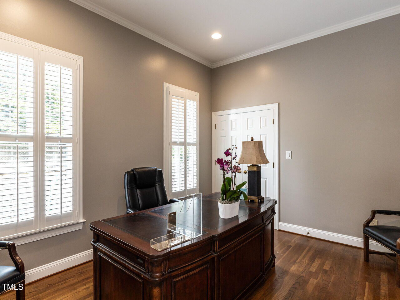 3108 Agecroft Road Raleigh, NC 27608 - Photo 17 of 42 a view of a workspace with furniture and a window
