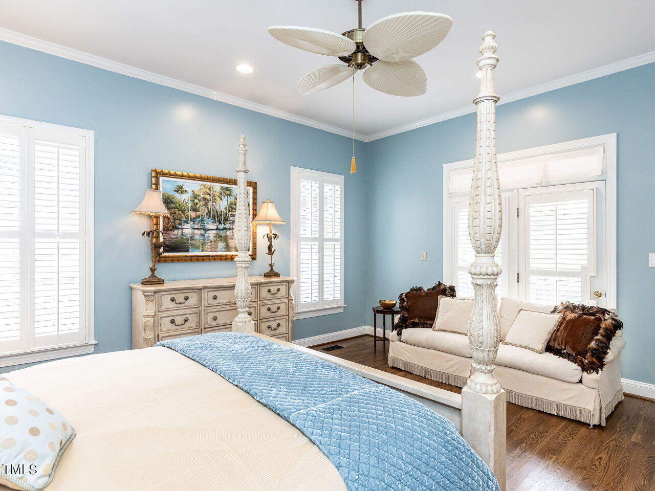 3108 Agecroft Road Raleigh, NC 27608 - Photo 20 of 42 a spacious bedroom with a bed and wooden floor