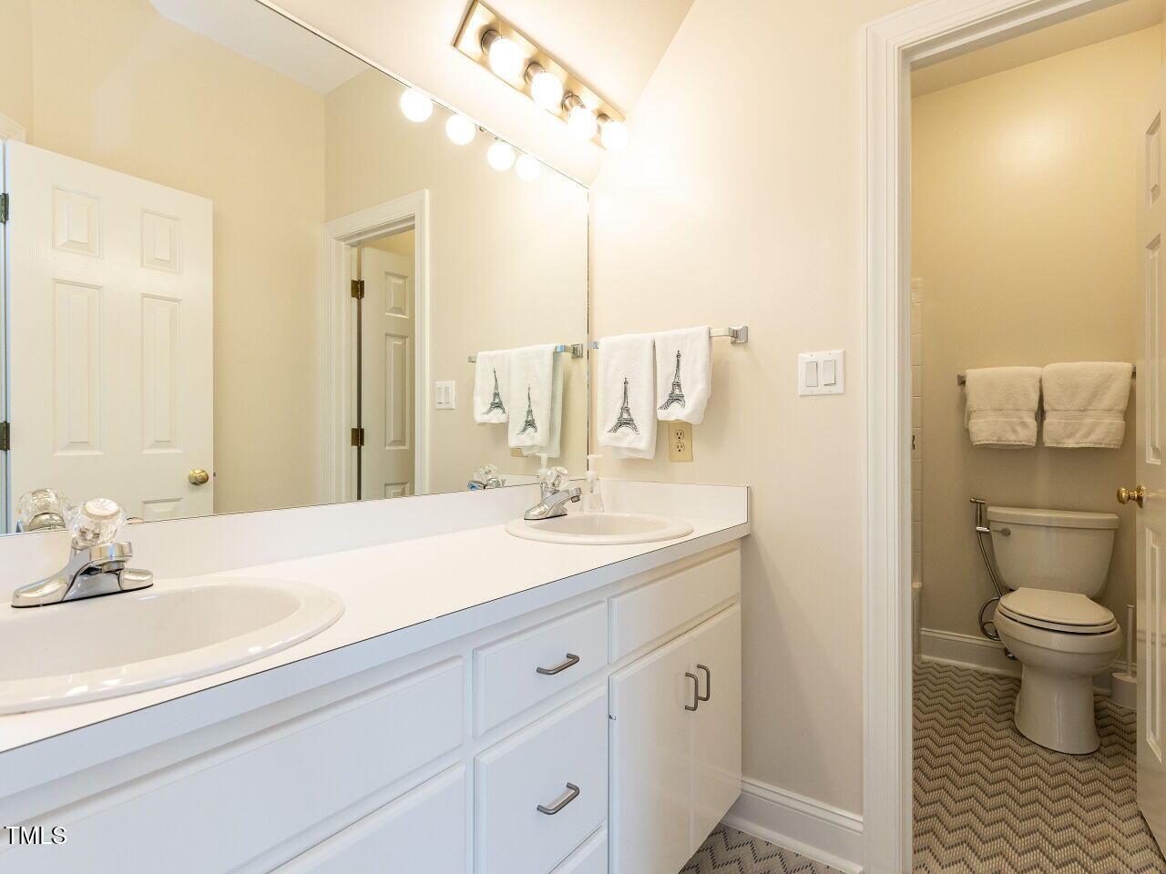 3108 Agecroft Road Raleigh, NC 27608 - Photo 26 of 42 a bathroom with a sink a toilet and shower