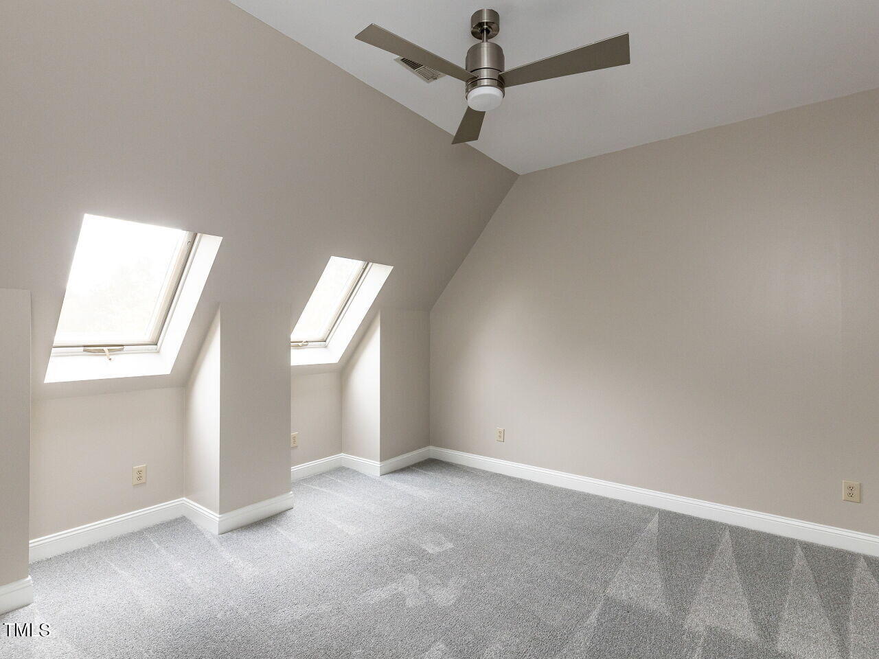 3108 Agecroft Road Raleigh, NC 27608 - Photo 27 of 42 an empty room with windows and fan