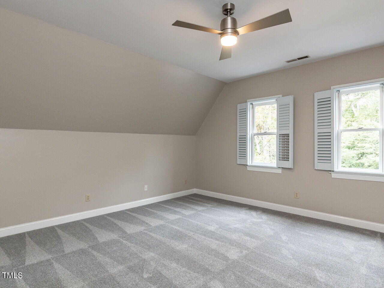 3108 Agecroft Road Raleigh, NC 27608 - Photo 30 of 42 an empty room with a window and ceiling fan