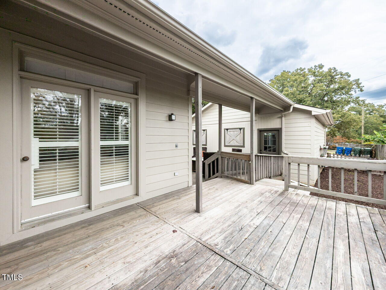 3108 Agecroft Road Raleigh, NC 27608 - Photo 37 of 42 a view of a house with a barbeque grill and wooden floor