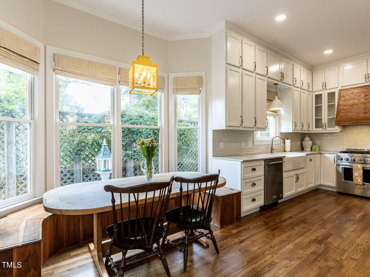 3108 Agecroft Road Raleigh, NC 27608 - Photo 6 of 42 a view of a dining room with furniture window and wooden floor
