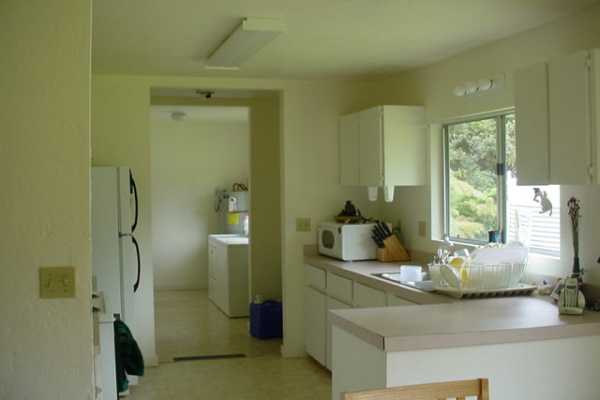 11-3771 4th Street Volcano, HI 96785 - Photo 4 of 7 a bathroom with a granite countertop sink a mirror and a shower