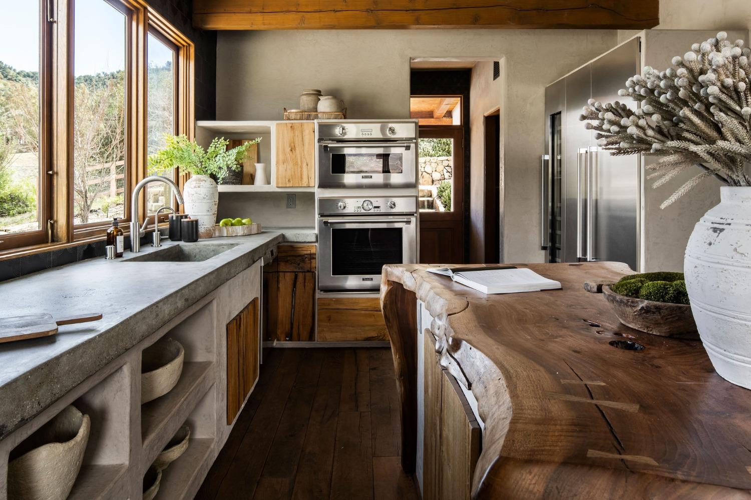 12980 Ojai Road Santa Paula, CA 93060 - Photo 18 of 38 a kitchen with a sink stove and cabinets