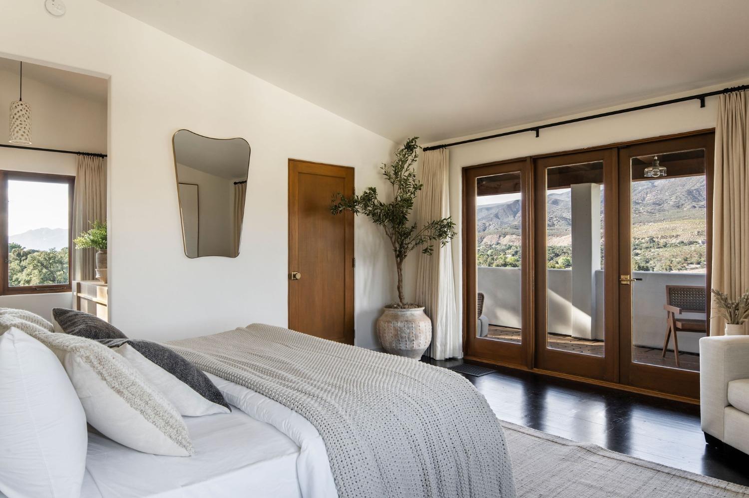 12980 Ojai Road Santa Paula, CA 93060 - Photo 19 of 38 a bedroom with a large bed and a large window