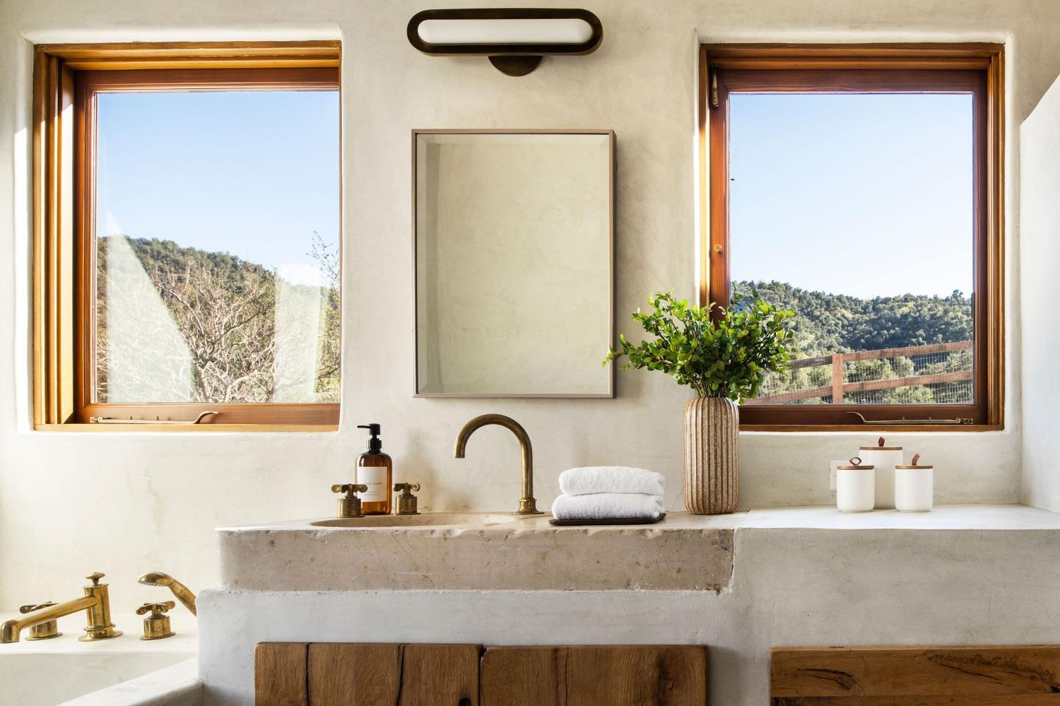 12980 Ojai Road Santa Paula, CA 93060 - Photo 26 of 38 a bathroom with a granite countertop sink and a window