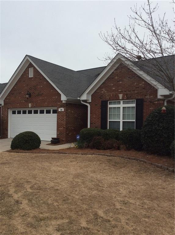 125 Regency Row Southwest Calhoun, GA 30701 - Photo 1 of 1 a front view of a house with a yard