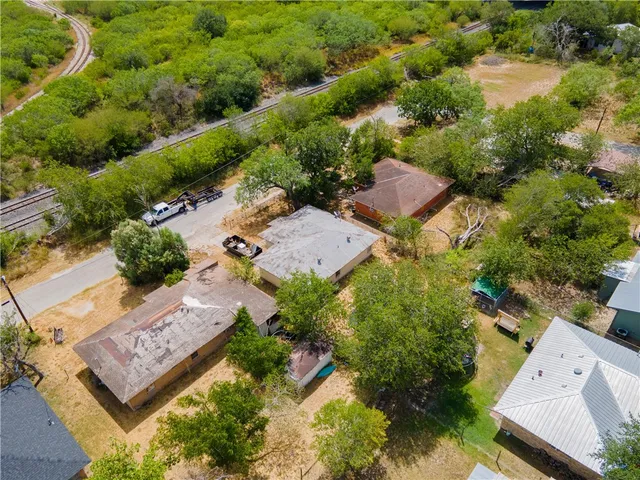 an aerial view of residential house with outdoor space and street view
