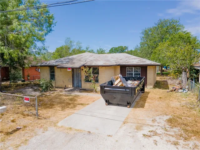 a view of a house with pool and chairs