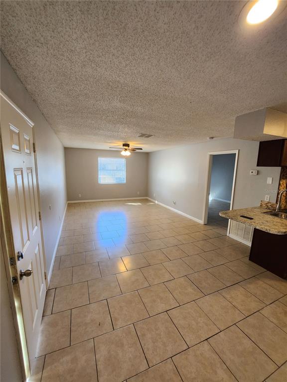 626 Golden Raintree Place, Unit 626 Brandon, FL 33510 - Photo 2 of 9 a view of a livingroom with wooden floor and furniture