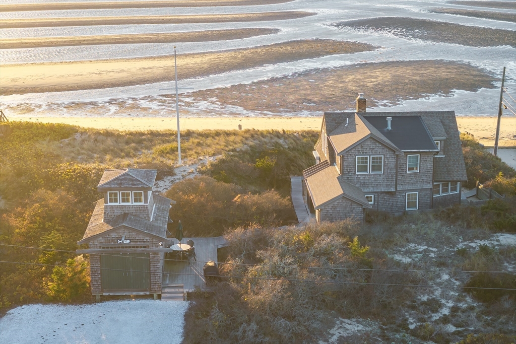 1145 Kingsbury Beach Road Eastham, MA 02642 - Photo 1 of 42 a view of houses with sky view