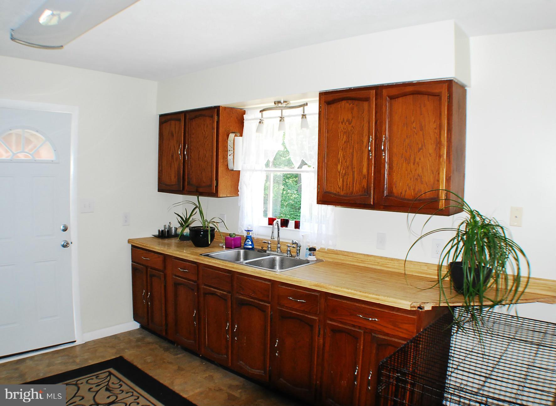 155 Fries Loop Road White Post, VA 22663 - Photo 12 of 29 a kitchen with a sink and cabinets