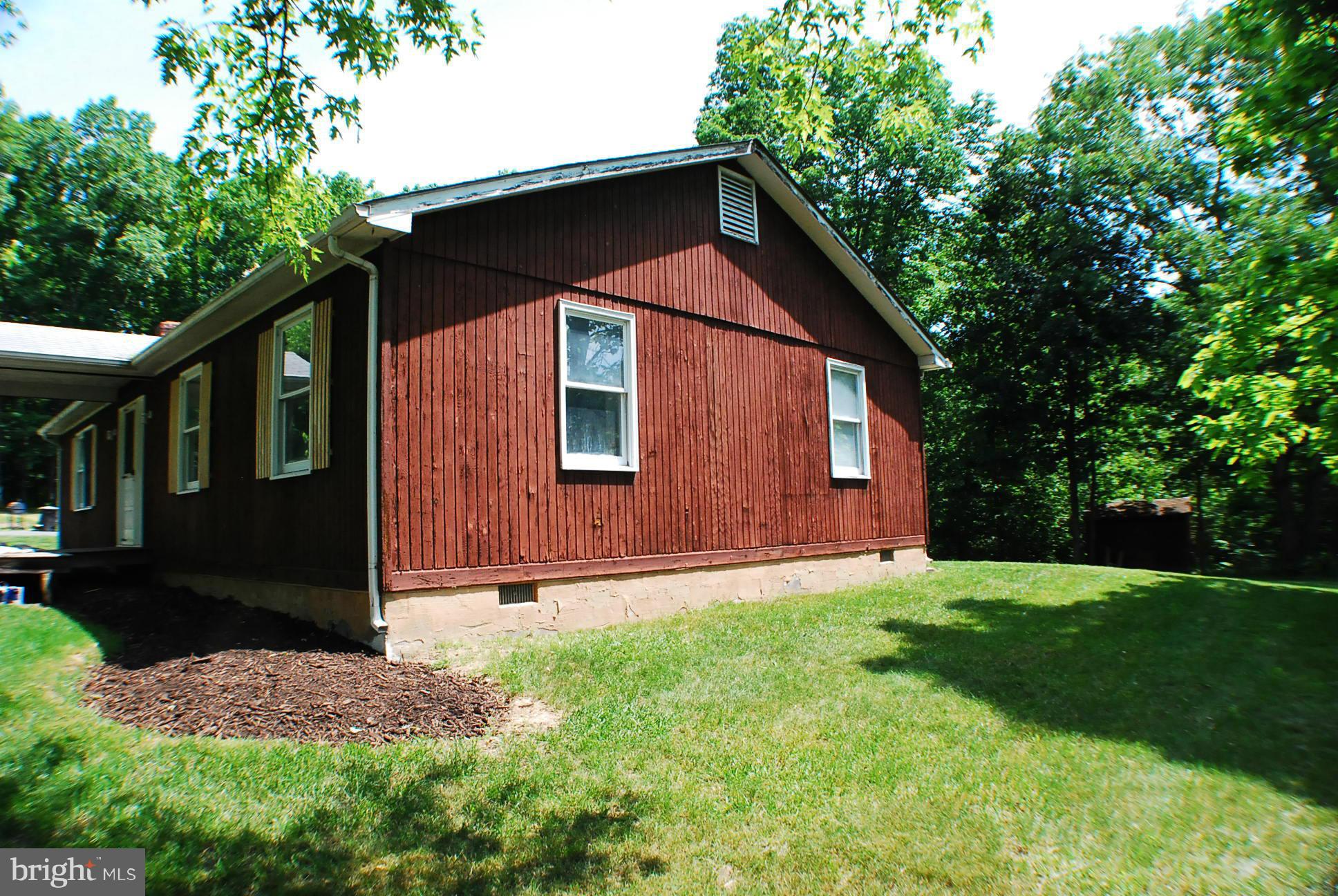 155 Fries Loop Road White Post, VA 22663 - Photo 3 of 29 a backyard of a house with lots of green space