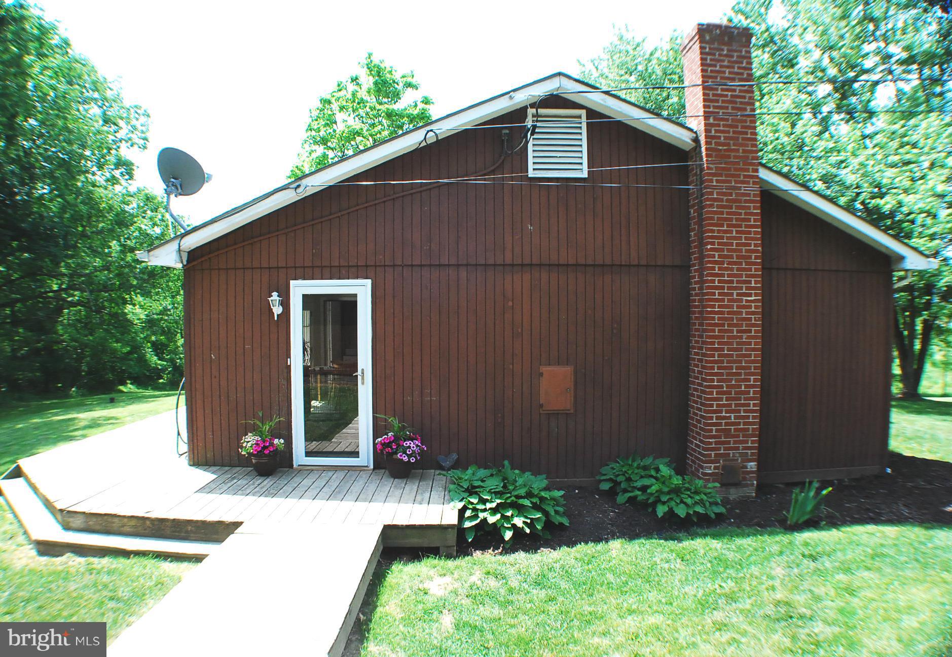 155 Fries Loop Road White Post, VA 22663 - Photo 4 of 29 a front view of a house with garden