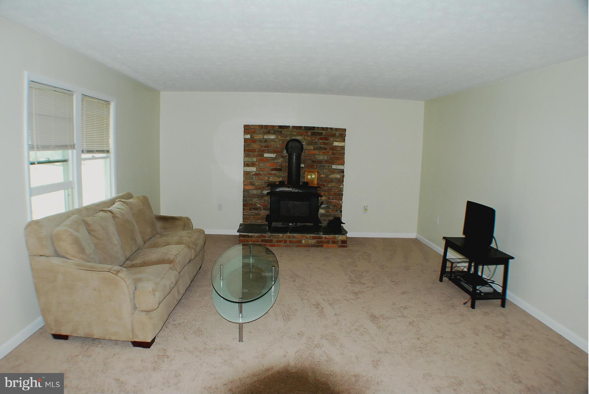 155 Fries Loop Road White Post, VA 22663 - Photo 9 of 29 a living room with furniture and a window