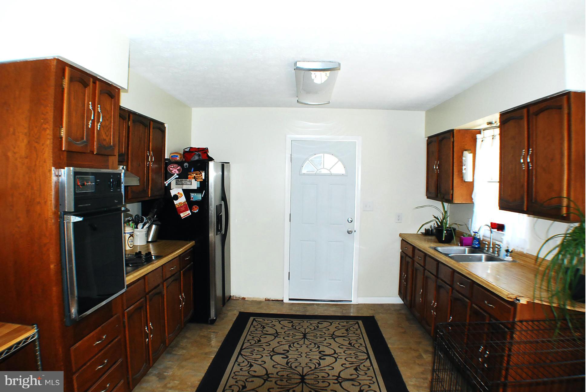 155 Fries Loop Road White Post, VA 22663 - Photo 10 of 29 a kitchen with sink cabinets and utility
