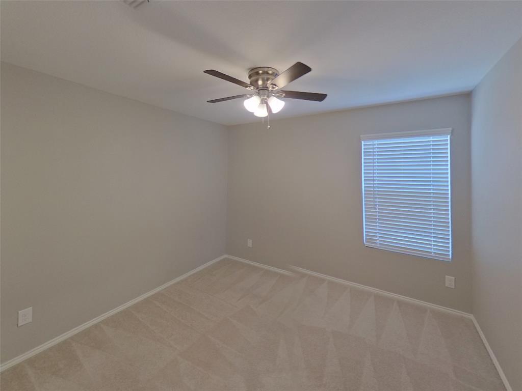 116 Cornstalk Lane Princeton, TX 75407 - Photo 12 of 17 a view of a room with a ceiling fan and a window