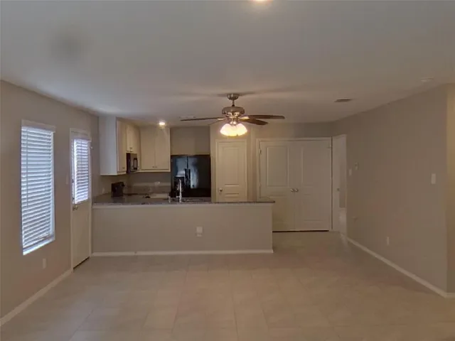 a view of living room and kitchen with furniture