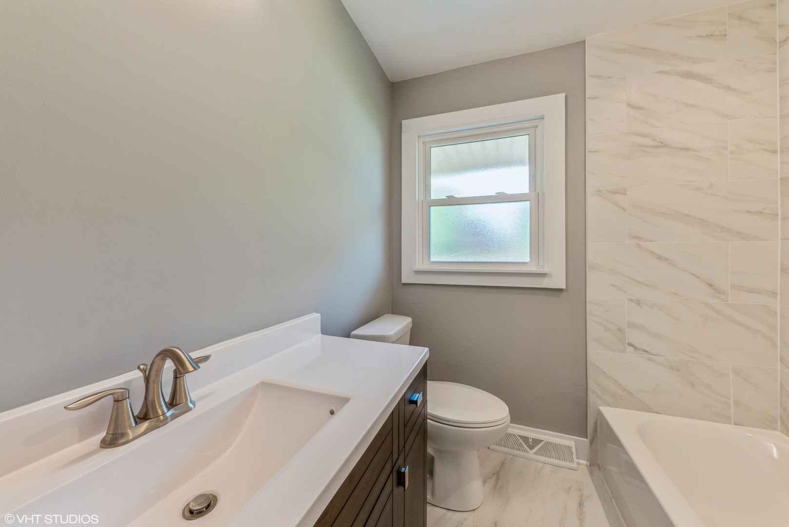 108 Roberts Road New Lenox, IL 60451 - Photo 8 of 16 a bathroom with a sink a toilet and shower