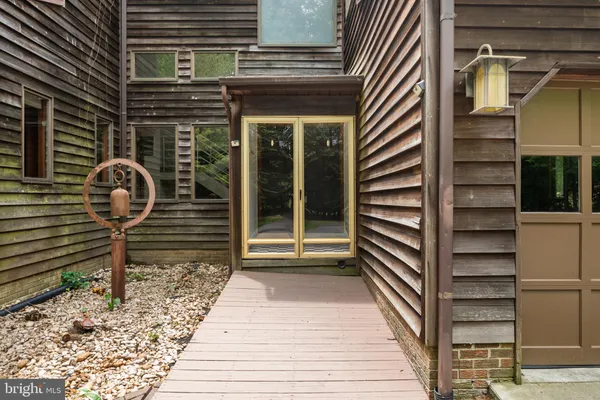 a bathroom with a sink tub double vanity and a mirror