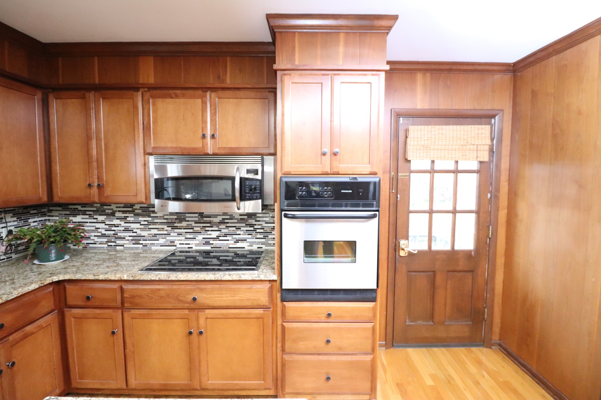 545 Puryears Bend Road Hartsville, TN 37074 - Photo 14 of 50 a kitchen with stainless steel appliances granite countertop a stove a microwave and cabinets