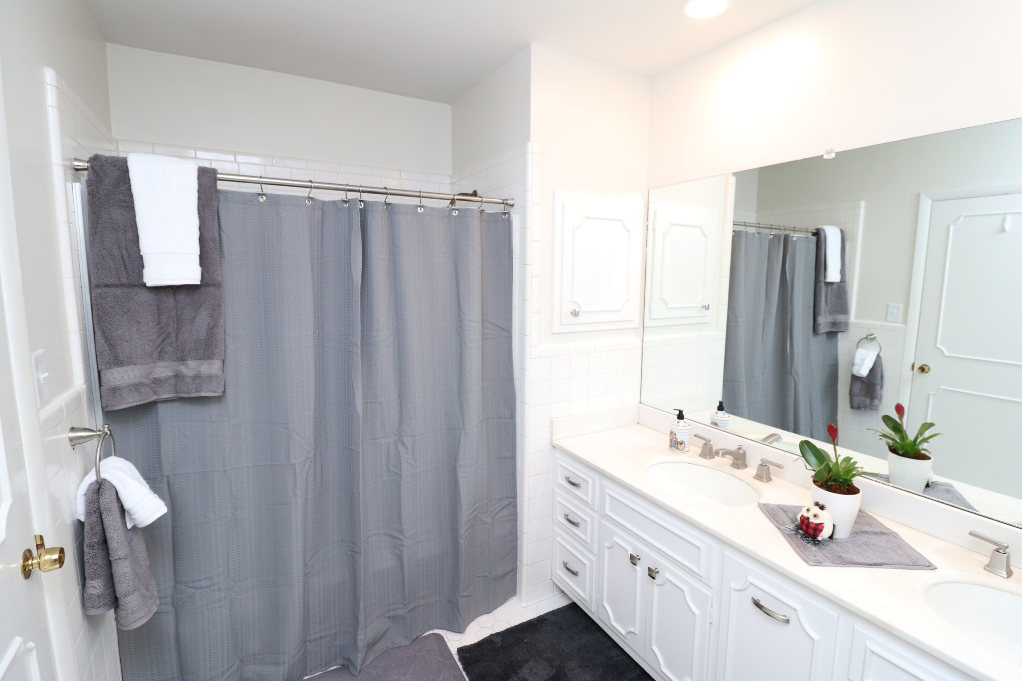 545 Puryears Bend Road Hartsville, TN 37074 - Photo 22 of 50 a bathroom with a double vanity sink and mirror