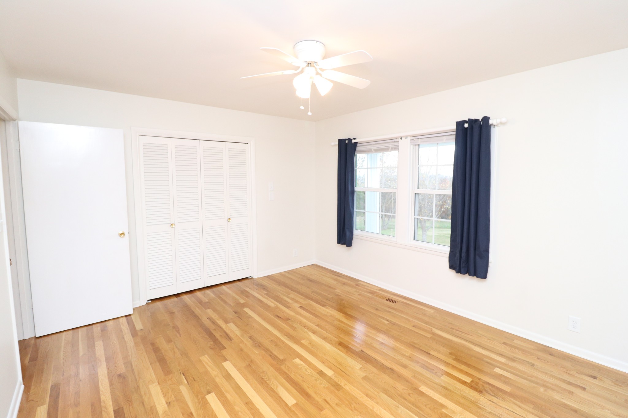 545 Puryears Bend Road Hartsville, TN 37074 - Photo 24 of 50 a bedroom with a bed and a large window