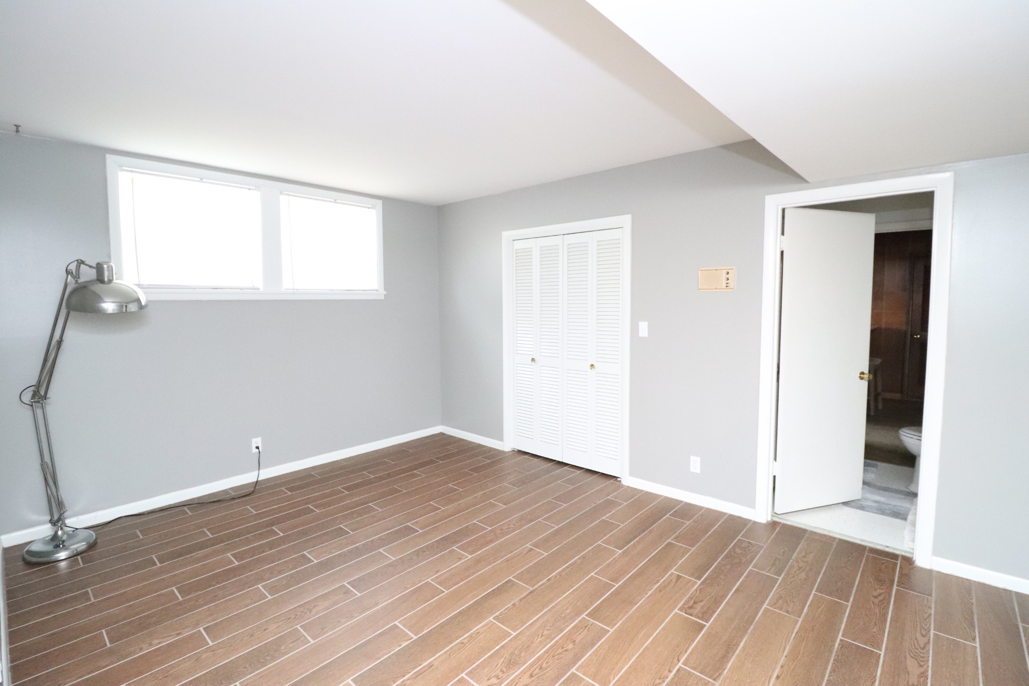 545 Puryears Bend Road Hartsville, TN 37074 - Photo 28 of 50 a view of a room with wooden floor and a ceiling fan