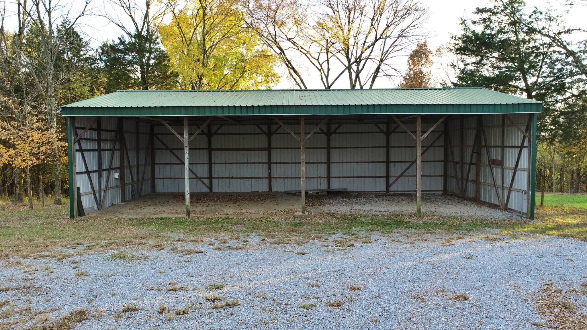 545 Puryears Bend Road Hartsville, TN 37074 - Photo 44 of 50 a view of a house with a large tree and a wooden fence