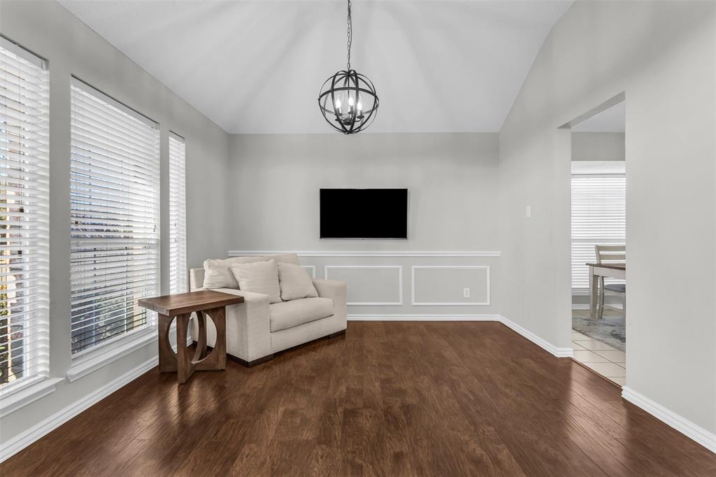 308 Glen Ridge Drive Murphy, TX 75094 - Photo 6 of 36 a living room with furniture and a flat screen tv