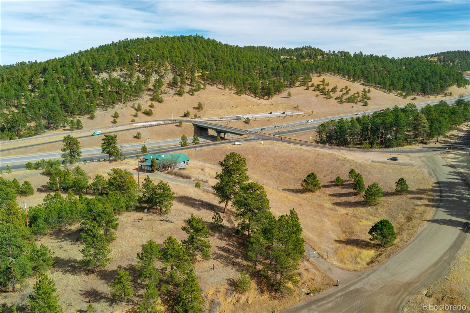 29793 Ruby Ranch Road Evergreen, CO 80439 - Photo 14 of 39 a view of a lake with houses