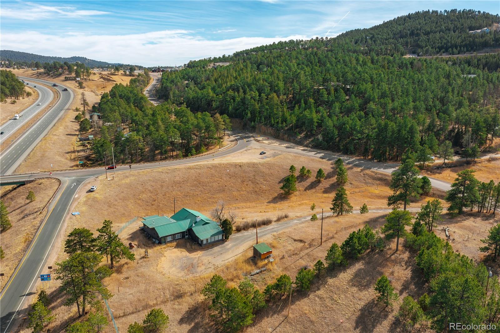 29793 Ruby Ranch Road Evergreen, CO 80439 - Photo 15 of 39 a view of a lake with a mountain